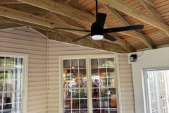 T1-11 plywood open rafter with rafter ties ceiling.