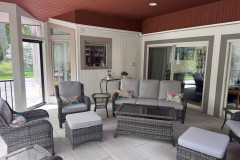 Porch has a ceiling fan, recessed lights and a storm door leading to the yard. (MAKE COVER PHOTO)