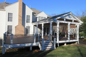 Deck and Open Porch in Wolf Weathered Ipe and Trex Reveal Rail - Oakton