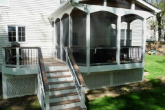 Screen porch and deck in Wolf Amberwood decking. Trex Transcends railing - Annandale, VA