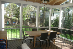 Screen porch and deck in Wolf Amberwood decking. Trex Transcends railing - Annandale, VA