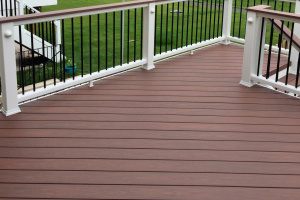 Deck with Wolf Amberwood decking and Trex Transcends railing - Ashburn, VA