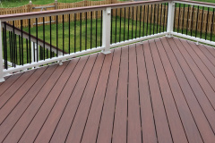 Deck with Wolf Amberwood decking and Trex Transcends railing - Ashburn, VA