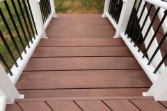 Deck with Wolf Amberwood decking and Trex Transcends railing - Ashburn, VA