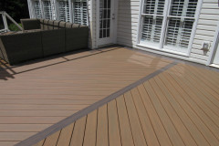 Deck with Wolf Amberwood and Black Walnut border and Trex Transcends railing - Herndon, VA