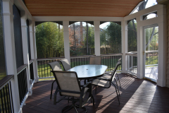 Screen porch in Wolf Rosewood decking. Trex Transcends railing - Alexandria, VA
