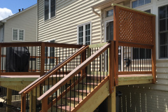 Deck with Wolf Rosewood decking, wood railing with Deckorator balusters - Bristow, VA
