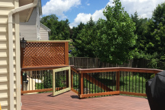 Deck with Wolf Rosewood decking, wood railing with Deckorator balusters - Bristow, VA