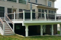 Decking in Trex Tiki Torch. Railing in white Trex Transcends with Tree House cocktail rail and black balusters in Ashburn, VA
