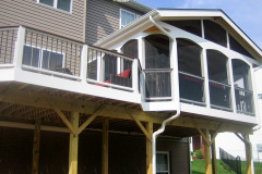 Screen porch and deck in Wolf Amberwood and Rosewood decking. Trex Transcends railing - Woodbridge, VA